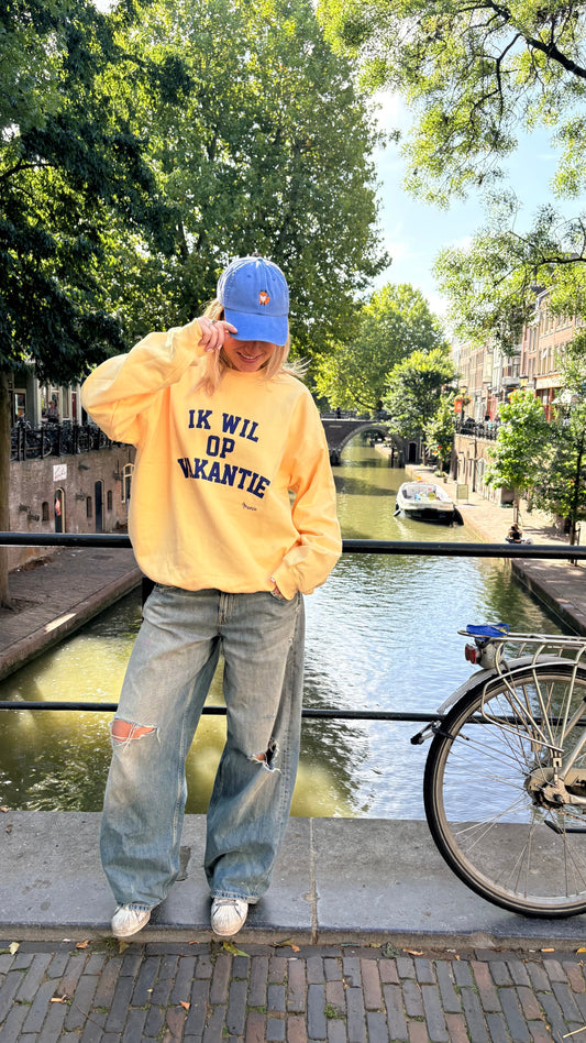 NIEUW Trui: “Ik wil op Vakantie” Zacht Geel met Blauw