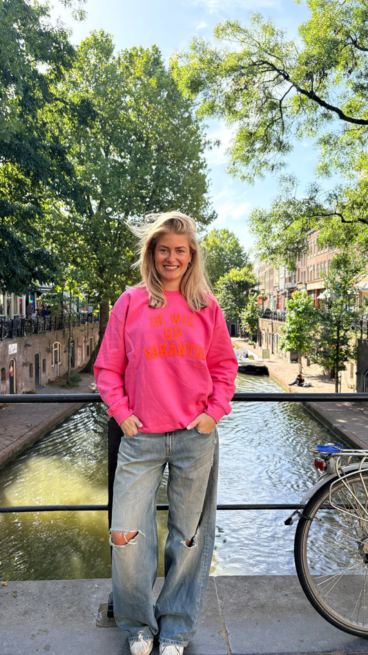 Trui: “Ik wil op Vakantie” Roze met neon oranje